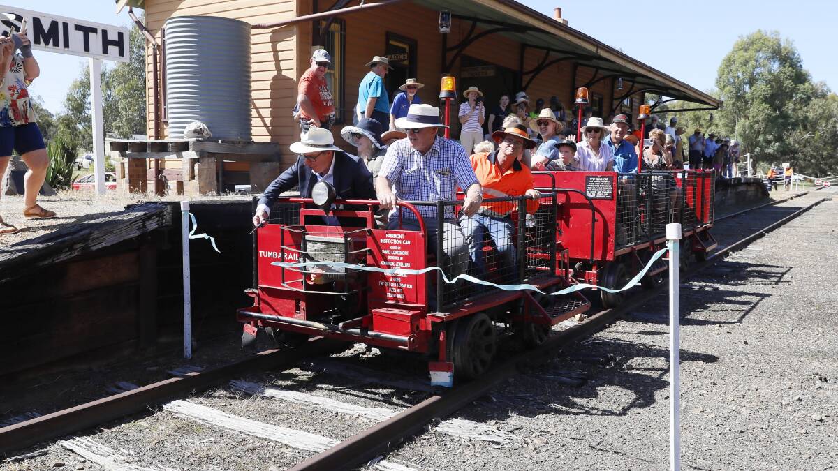 Member for Wagga Joe McGirr cuts the ribbon on the maiden journey of the newly-opened Ladysmith Tourist Railway. Picture by Les Smith