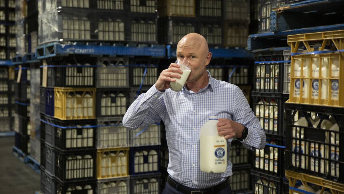 BIG DRINK: Riverina Fresh CEO Rob Collier celebrates as the dairy producer brings up its century in 2022. Picture: Madeline Begley 