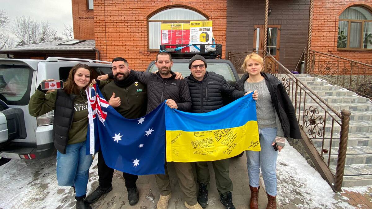 Wagga man Damian Nye, centre, alongside his fellow aid workers in Ukraine. Picture: supplied