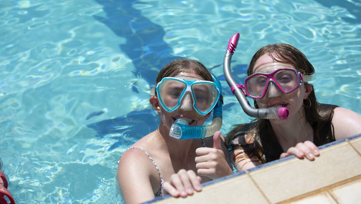 THUMBS UP: Lucy Fulham and Josie Galvin teamed up at the Kooringal High swimming Carnival. Picture: Madeline Begley.
