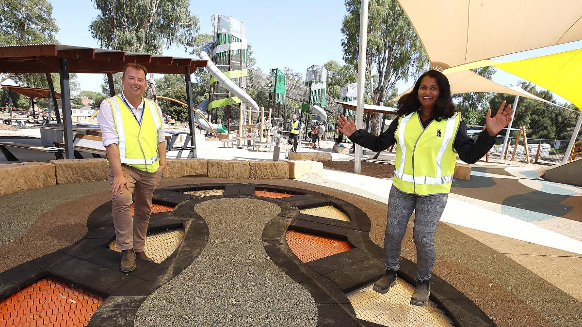 JUMPING FOR JOY: Wagga City Council's Ben Creighton and Srivalli Miah at the new riverside playground. Picture: Les Smith.