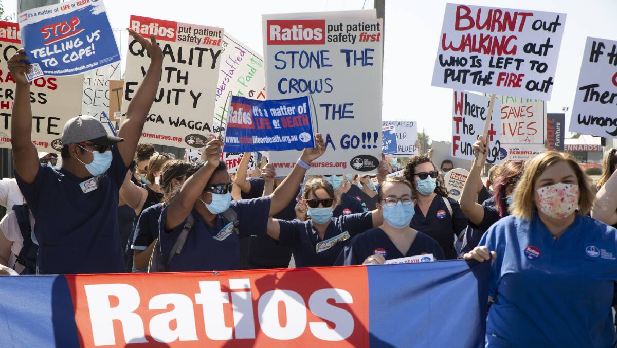 BURNT OUT: Nurses and members of the NSW Nurses and Midwives' Association march through town, demanding better staff to patient ratios in hospitals. Picture: Madeline Begley