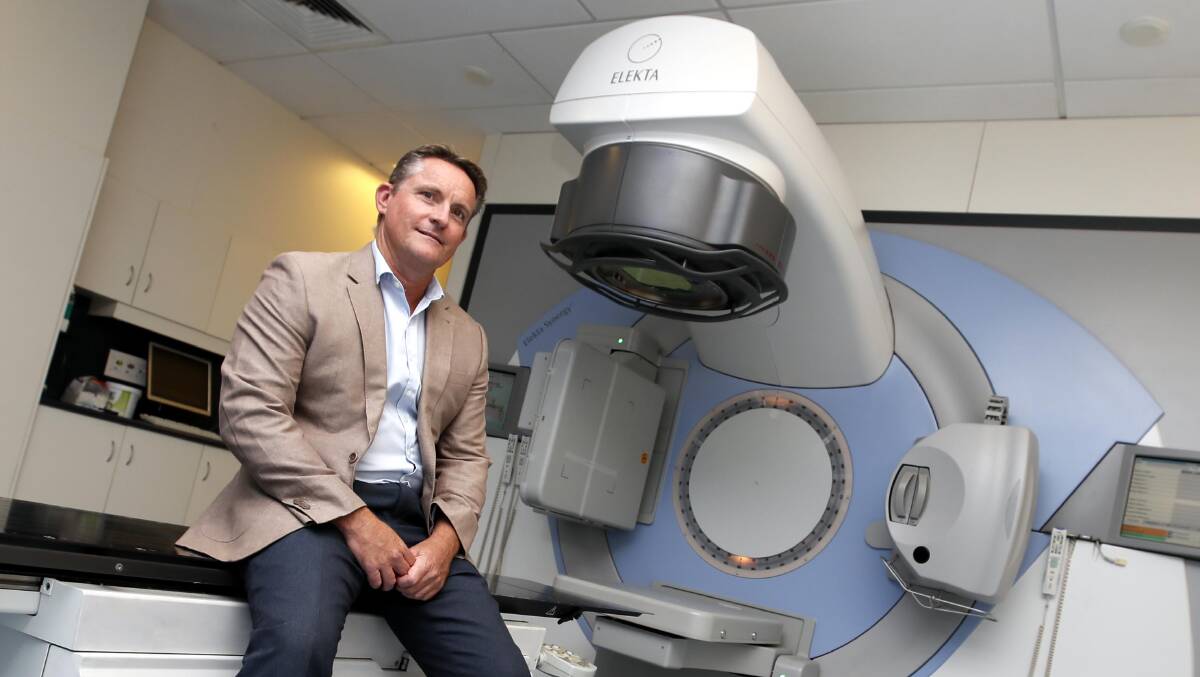 CARE CLOSE TO HOME: Damien Williams with a linear accelerator at the Riverina Cancer Care Centre, which is celebrating its 20th anniversary this week. Picture: Les Smith