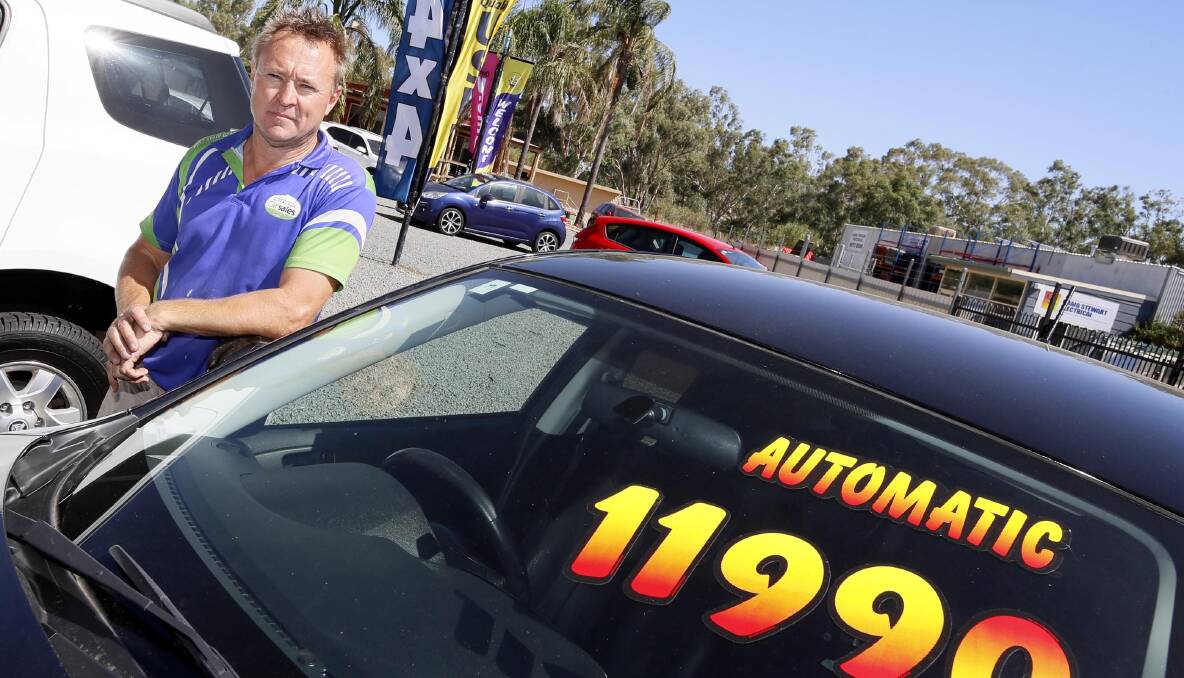 ROARING TRADE: Chris Melmoth from Murrumbidgee Car Sales says it is rare for a car to last more than two weeks on his lot before selling. Picture: Les Smith