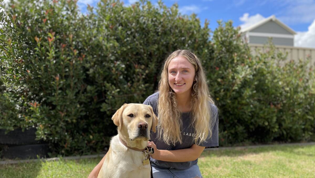 NEW KID ON THE BLOCK: CSU vet student Zoe Hall with 2-year-old Labrador, Freddie. Picture: Angus Thomson