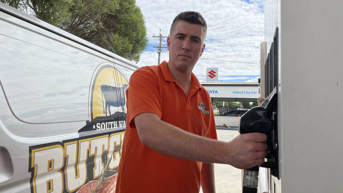 UNAVOIDABLE: South Wagga butcher Liam Hanigan fills up his delivery van as the price of regular unleaded hits $2 per litre. Picture: Angus Thomson