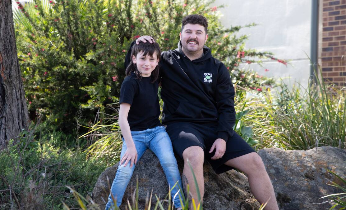 Wagga local and mentor Trey Charles with 10-year-old Kaiden Hinch, who joined Boys to the Bush last school term in the search for a positive role model. Picture by Madeline Begley 