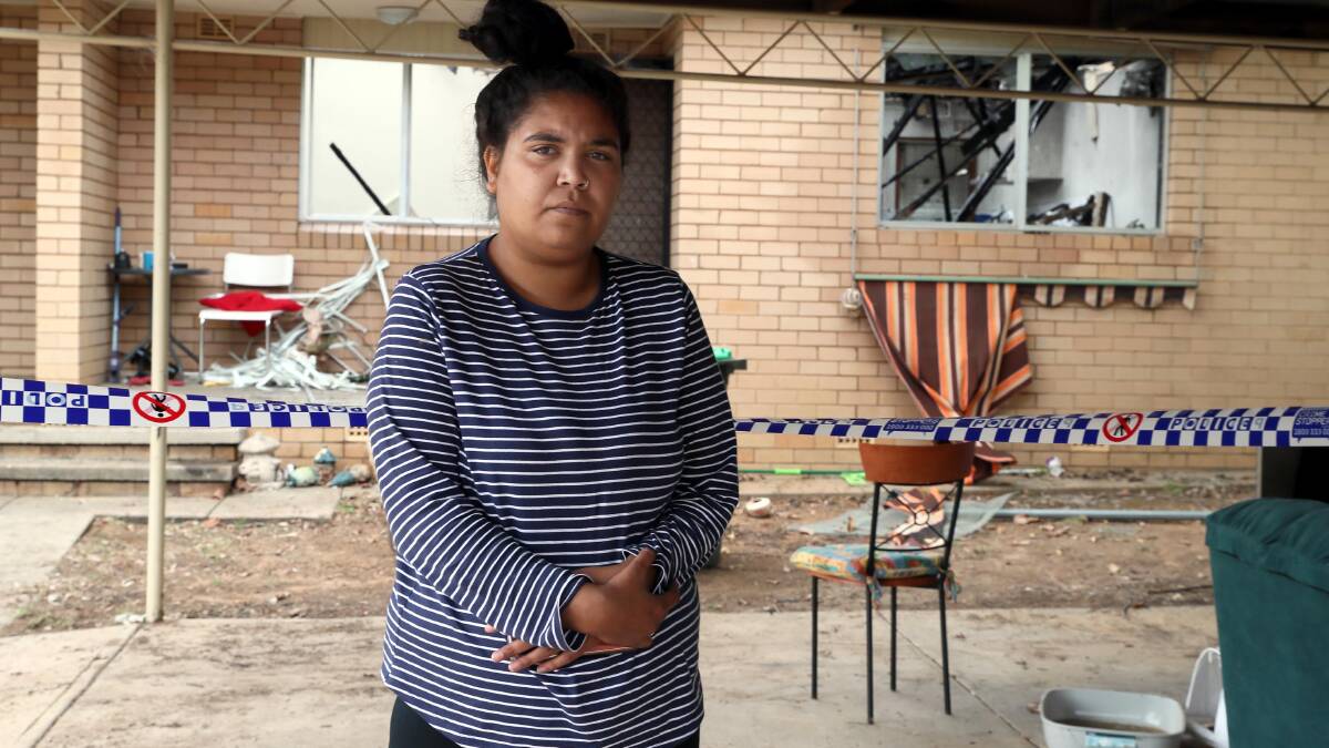 Kooringal resident Tameka Knight with the remains of the mattress which first caught fire in Monday's unit block blaze. Picture: Les Smith 