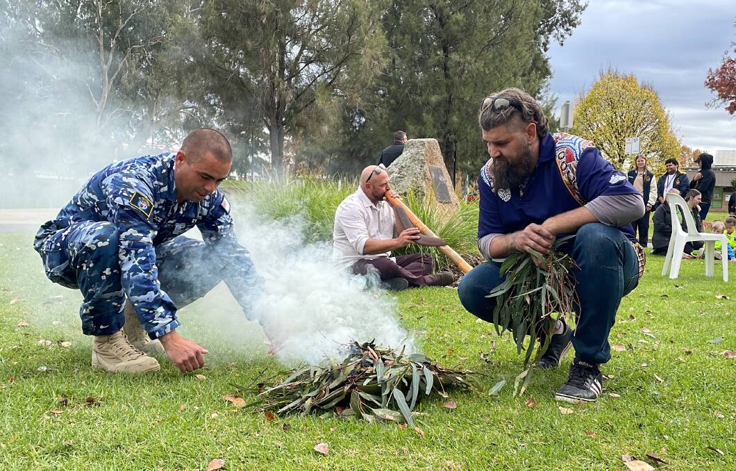 Peter Ingram (right) lead today's National Sorry Day smoking ceremony, while Luke Wighton played the didgeridoo. Picture: Tim Piccione 