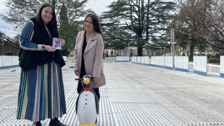 Wagga City Council's Emma Corbett (left) and Kimberly Parkers standing on Wagga's pop-up ice skating rink, which is in final stages of construction before it opens on Saturday. Pictrure: Tim Piccione 