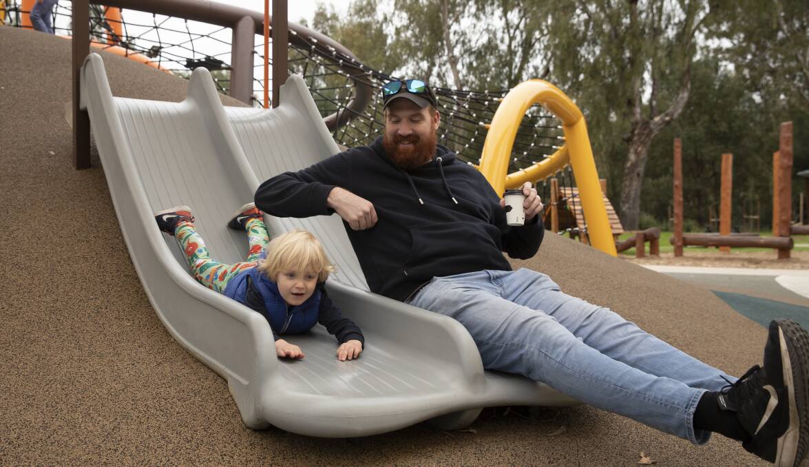 Not living far from the precinct, Will Holcombe took the first available opportunity to bring visiting nephew Theodore to try out the newly opened playground. Picture: Madeline Begley