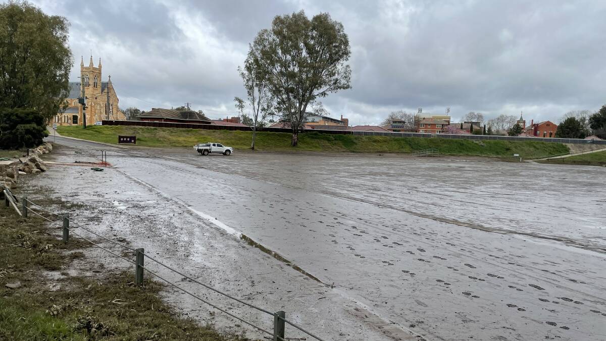 Wagga Beach carpark remains closed, still covered in a hazardous layer of mud after last week's flooding. Pictures: Tim Piccione 