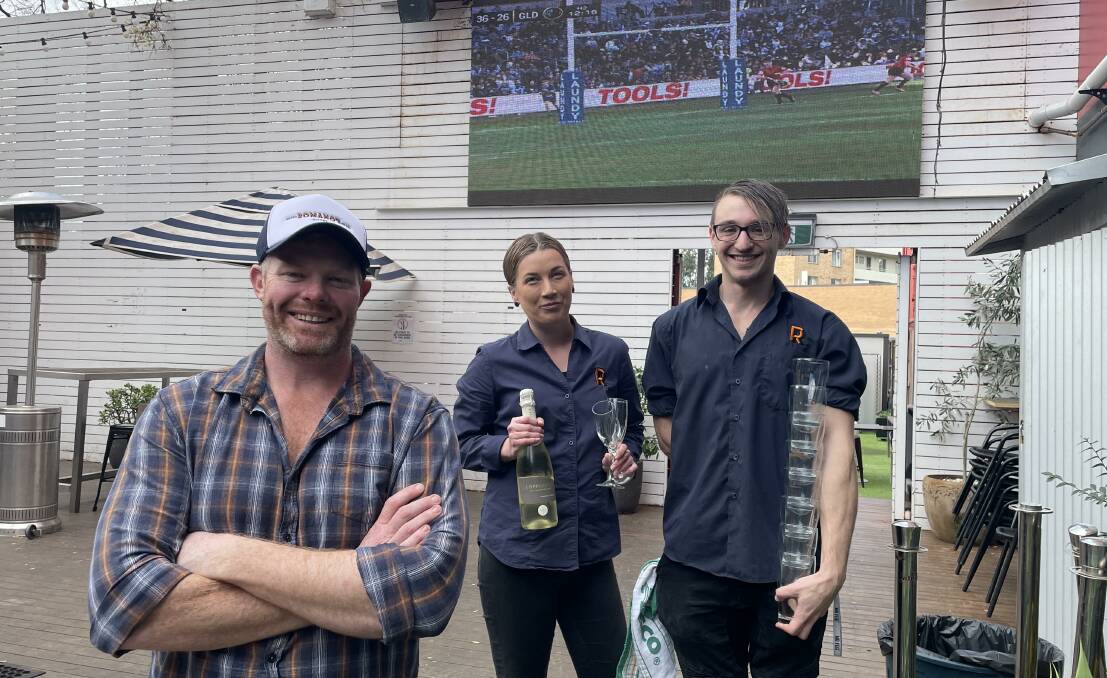 Romano's owner Matt Oates (left), here with Tiffany Riley and Gryce Harrison, will stay open late for major sporting events when allowed. Picture: Tim Piccione