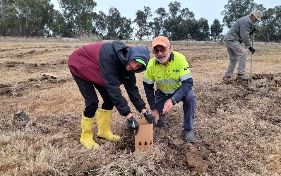 Frenchman Gabriel de Bure (left) and lifelong Wagga local John Craig making the most of the region, pictured here planting natives for National Tree Day. Picture: Supplied