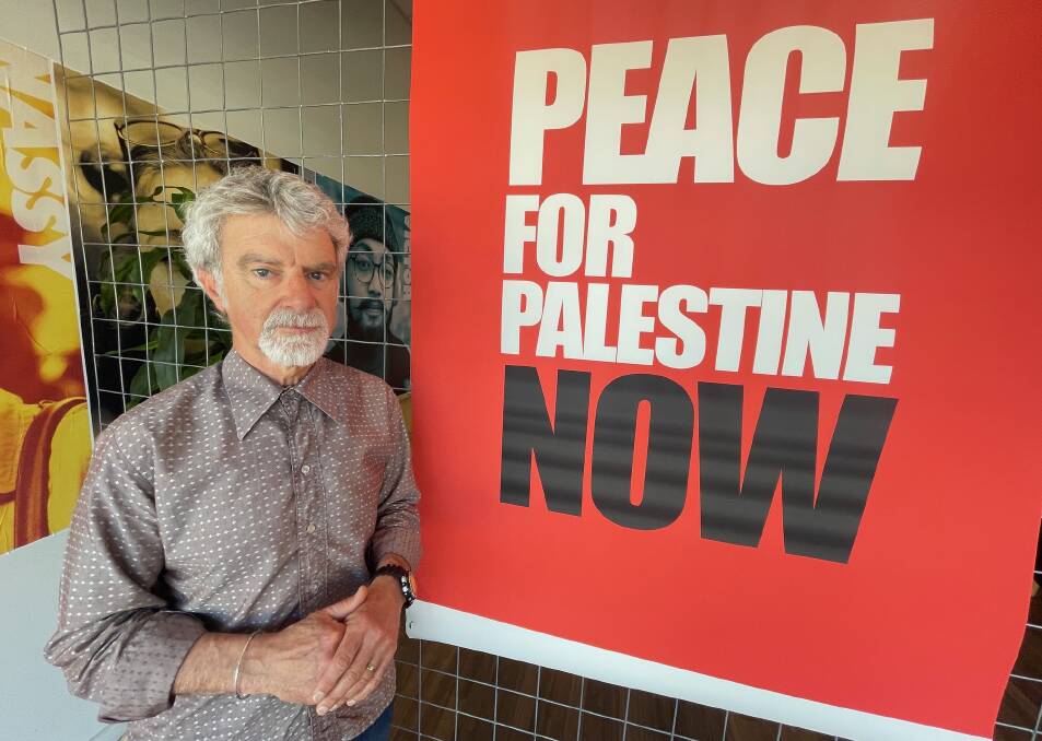 Advision director Michael Agzarian has now replaced the controversial poster with another and said his message is calling for peace to prevail. Picture by Andrew Mangelsdorf