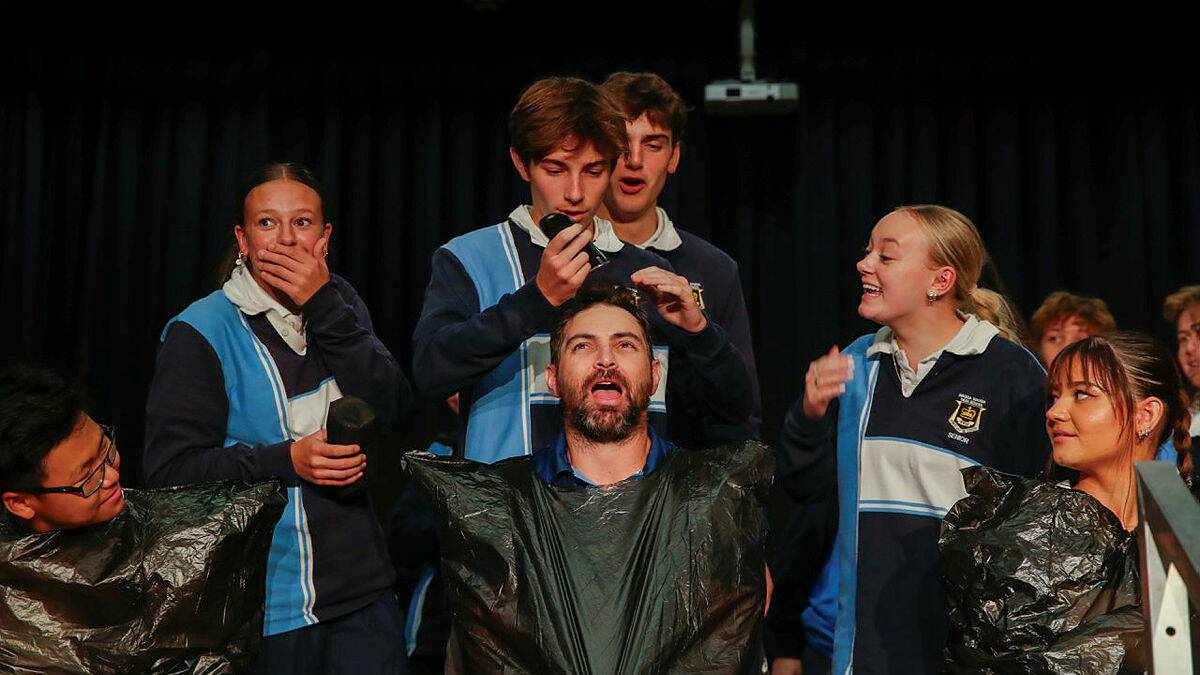 There was a bit of drama as Wagga High Year 12 students Amy Cowell, Lachlan Moore, Deacon Beckett and Chloe Mason shaved english teacher Scott Cox's hair for the World's Greatest Shave on Friday. Picture by Tom Dennis