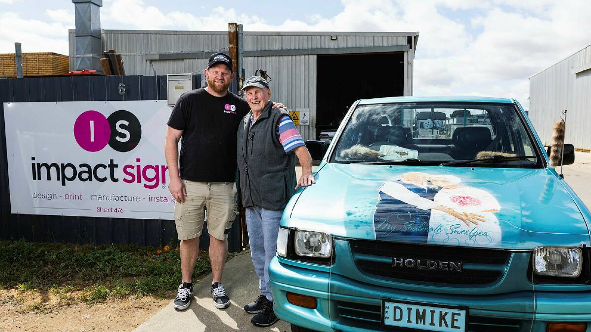 Impact Signs owner Pete Miller and Michael Henderson with the 1999 Holden Rodeo ute tribute to his late wife Dianne. Picture by Ash Smith