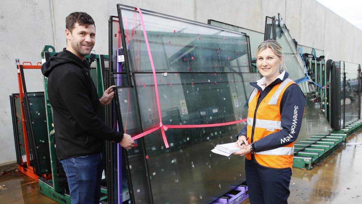 SURPRISE VISIT: SafeWork inspector Alicia Smith with Marc Sheppard during a visit to Wagga business Viewco Glass yesterday. SafeWork inspectors are conducting compliance checks across the city this week. Picture: Les Smith