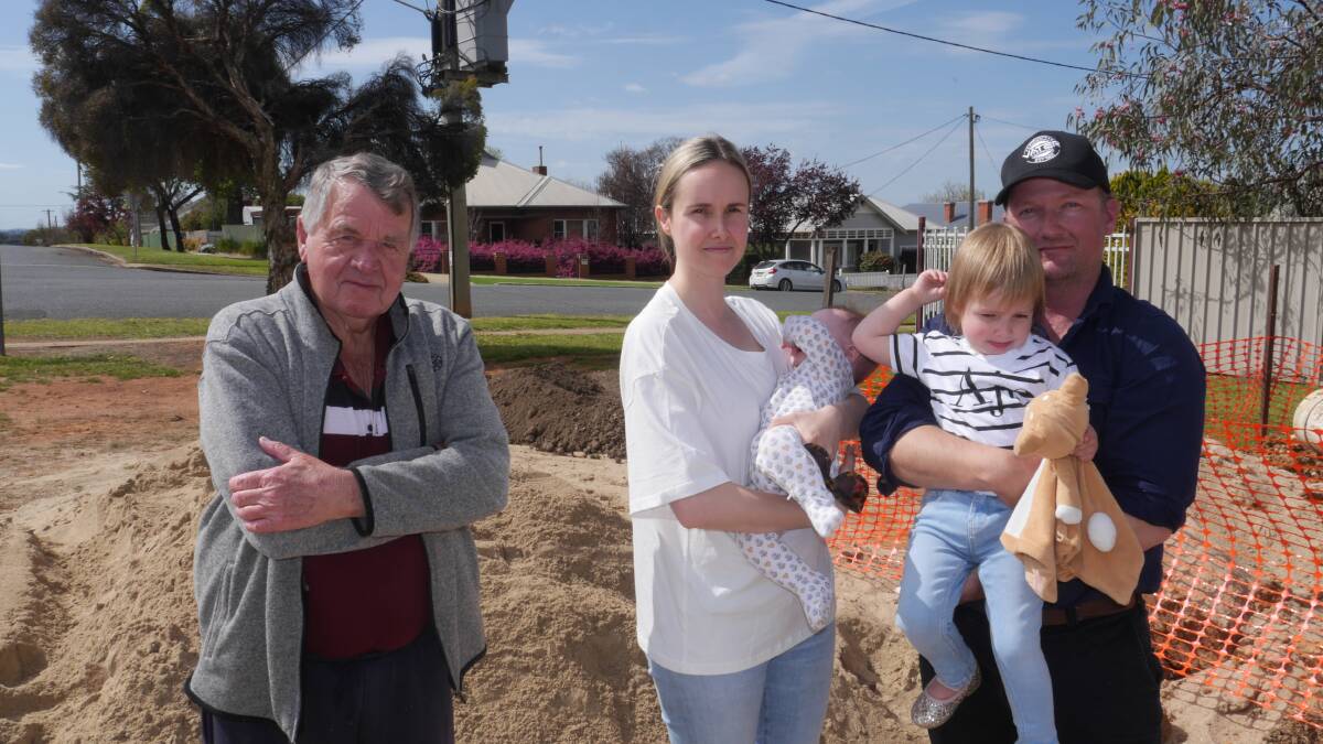 Fed up Turner Street residents Noel Christie (L), Bronte Nalder with daughters Violet (6 months) and Penelope (2) and neighbour Bryn Mathew at their local dumping ground on Tuesday. Picture by Andrew Mangelsdorf