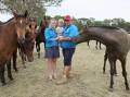 Wallendbeen couple Andrew and Emma Sheridan are facing an uphill battle in keeping their Kinloch Equine business afloat amid an ongoing fight with the government. They are pictured with their two-year-old son Harry. Picture by Les Smith