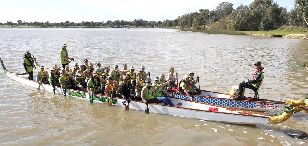 ON FIRE: Service personnel turned out to try their hand at dragon boating on Lake Albert at the weekend. Picture: Les Smith.