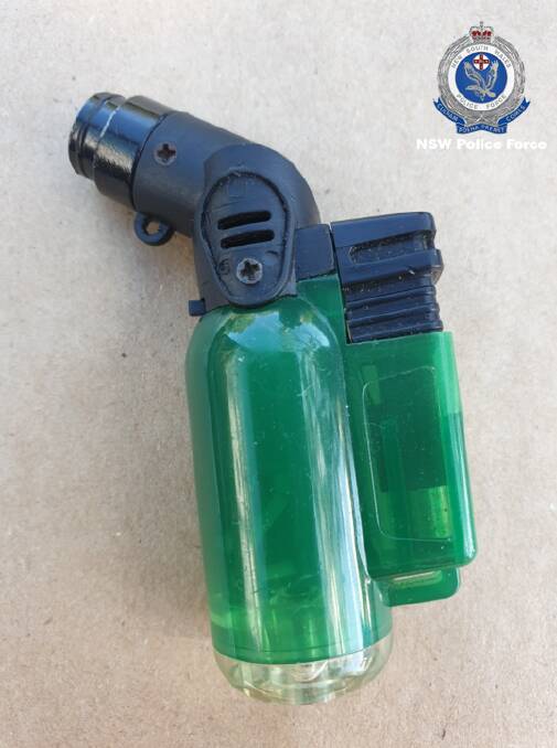 Police say they located a green cigarette lighter and a short wooden club during a search of the accused man's house. Pictures courtesy NSW Police