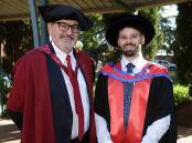 CSU faculty of business, justice and behavioural sciences Executive Dean Lewis Bizo with graduating PhD (Science) student and Higher Degree by Research University Medal recipient Jake Fountain on Tuesday. Picture by Tom Dennis
