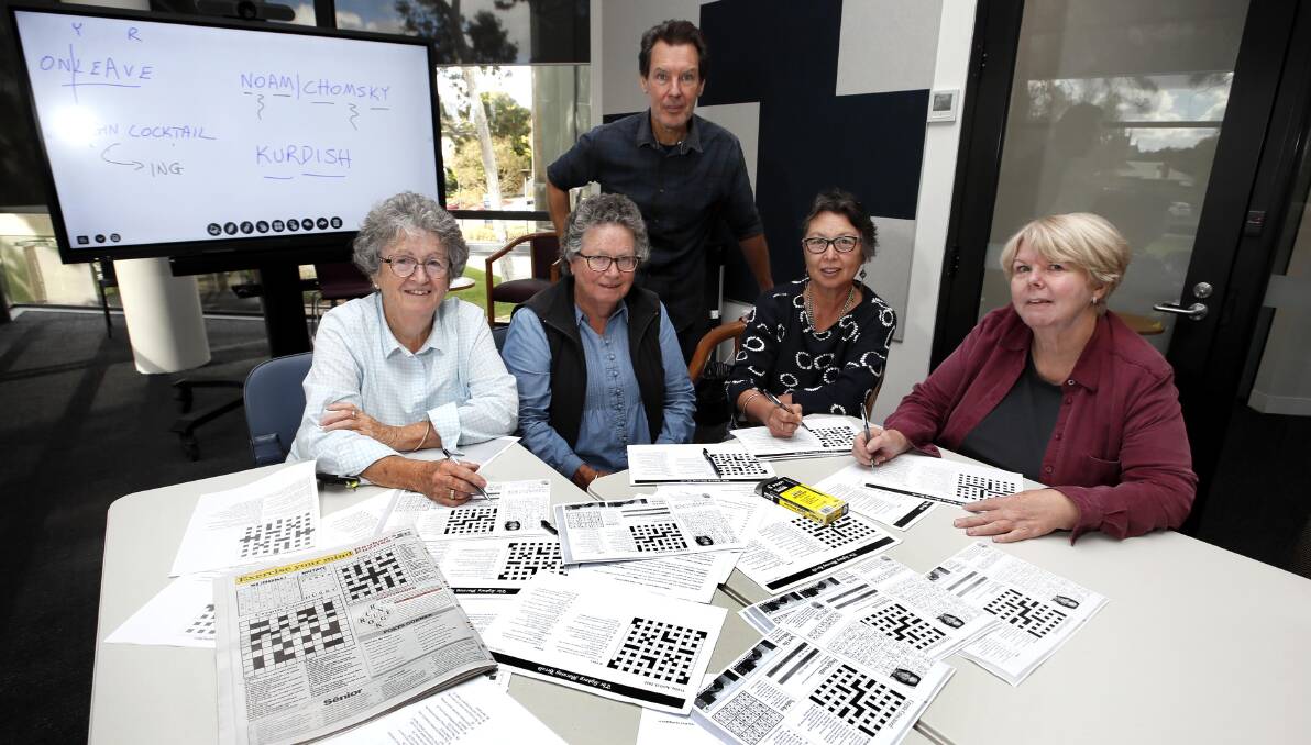 BRAIN TRAINING: The Wagga Cryptic Crossword Club loves a good puzzle. Peter Casey with Margaret Wendelin of Orange, Lyn Wendelin of Ladysmith, Jenny Garrett of Wagga and Alix Hopgood of Wagga. Picture: Les Smith