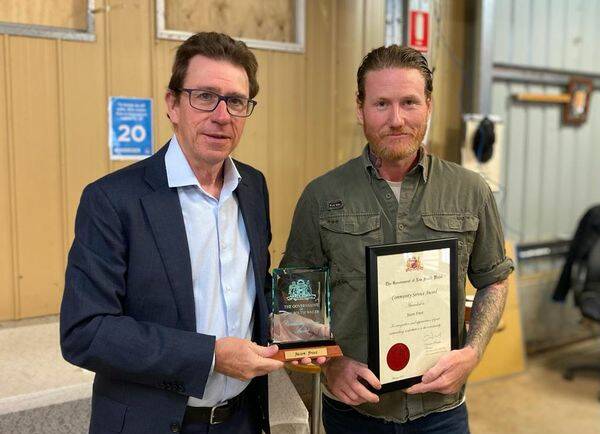 Great honour: Wagga MP Joe McGirr presents Wagga Defence Shed president Jason Frost with a community service award on Wednesday.