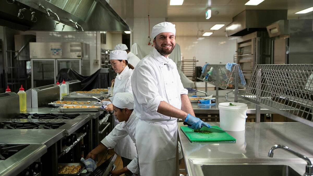 Qasm Sleman, who migrated from Iraq, pictured on the final day of a nine-week Commercial Cookery English Language program at Wagga TAFE. Picture by Madeline Begley