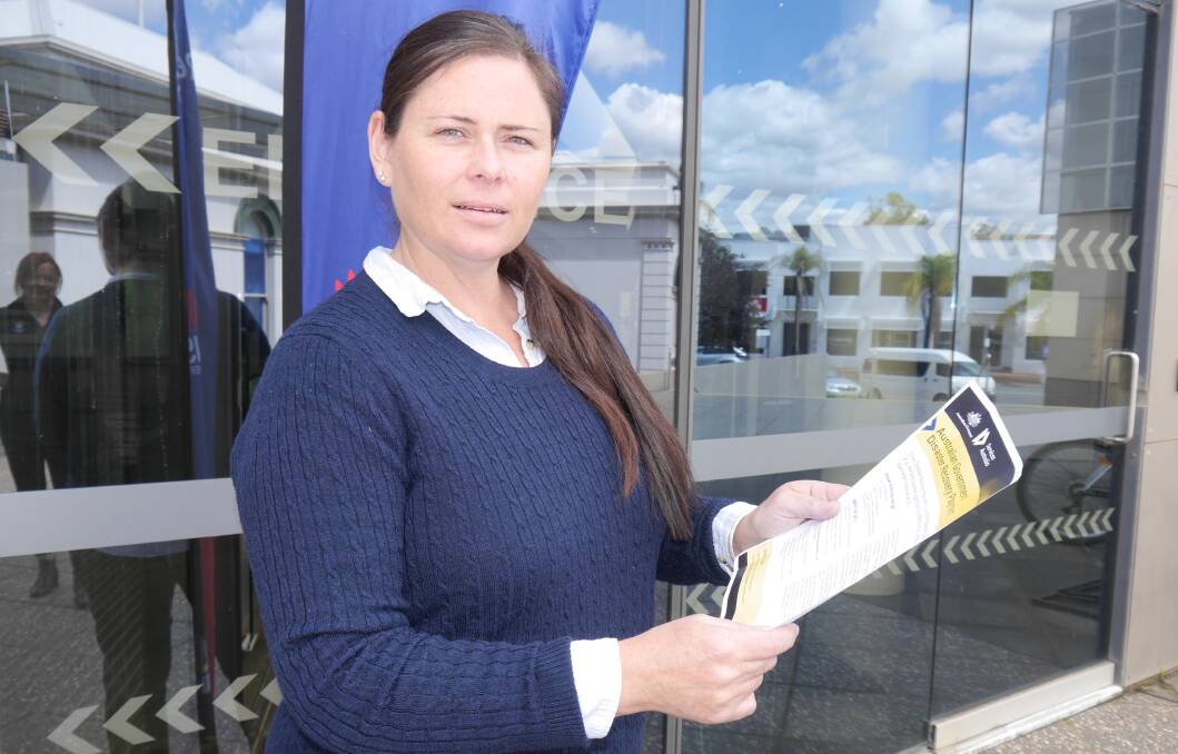 Tarcutta Hotel owner Emma Reynolds at the flood recovery centre in Wagga on Thursday. Picture by Andrew Mangelsdorf