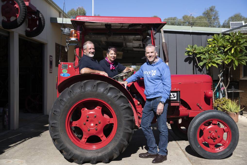 MND FIGHT: Two Rivers Run Vintage Tractor Trek committee members Neil and Robyn Cole with MNDRA executive director research Gethin Thomas. Picture: Madeline Begley