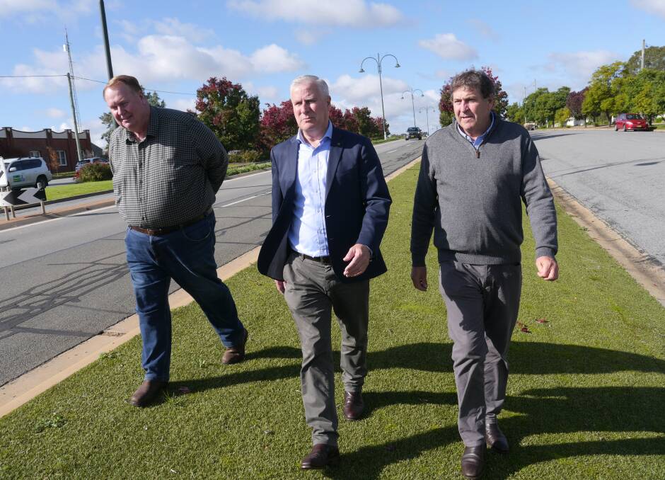 ROAD REPAIRS: Member for Riverina Michael mcCormack with Coolamon mayor David McCann (L) and General Manager Tony Donoghue (R) in Cowabbie Street on Monday. Picture: Andrew Mangelsdorf