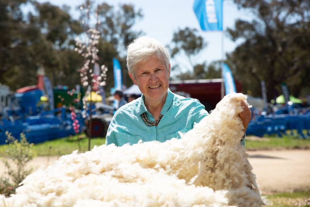 UK councillor on The Campaign for Wool Lesley Prior checks out first cross lambs' wool shorn by NSW TAFE Primary Industries Centre staff at the 2022 Henty Machinery Field Days. Picture by Madeline Begley.