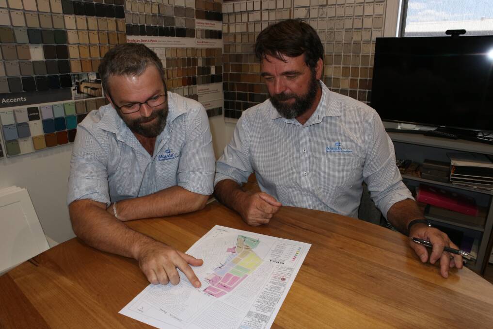 Alatalo Bros estimator Andrew Douglas and Wagga manager Paul Eady inspect the newly approved DA on Thursday. Picture by Andrew Mangelsdorf