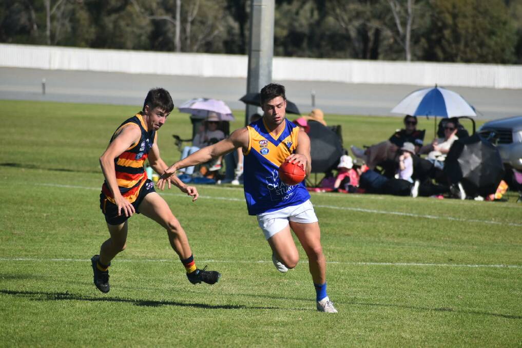 Narrandera's Blake Renet gets a kick away during the Eagles clash against Leeton-Whitton. Picture by Liam Warren