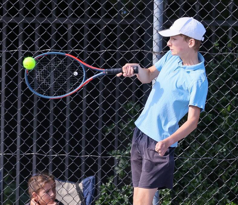 Liam Robinson keeps a close eye on the ball while competing in the Division One Wagga Junior Tennis competition grand final. Picture by Les Smith 