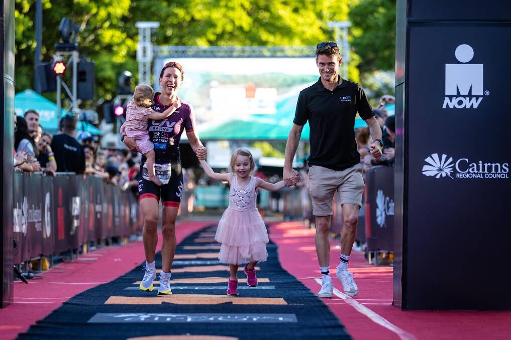 GRAND RETURN: Radka Kahlefeldt crosses the line joined by her husband Brad and two daughters Ruby and Indiana. Picture: Koruptvision