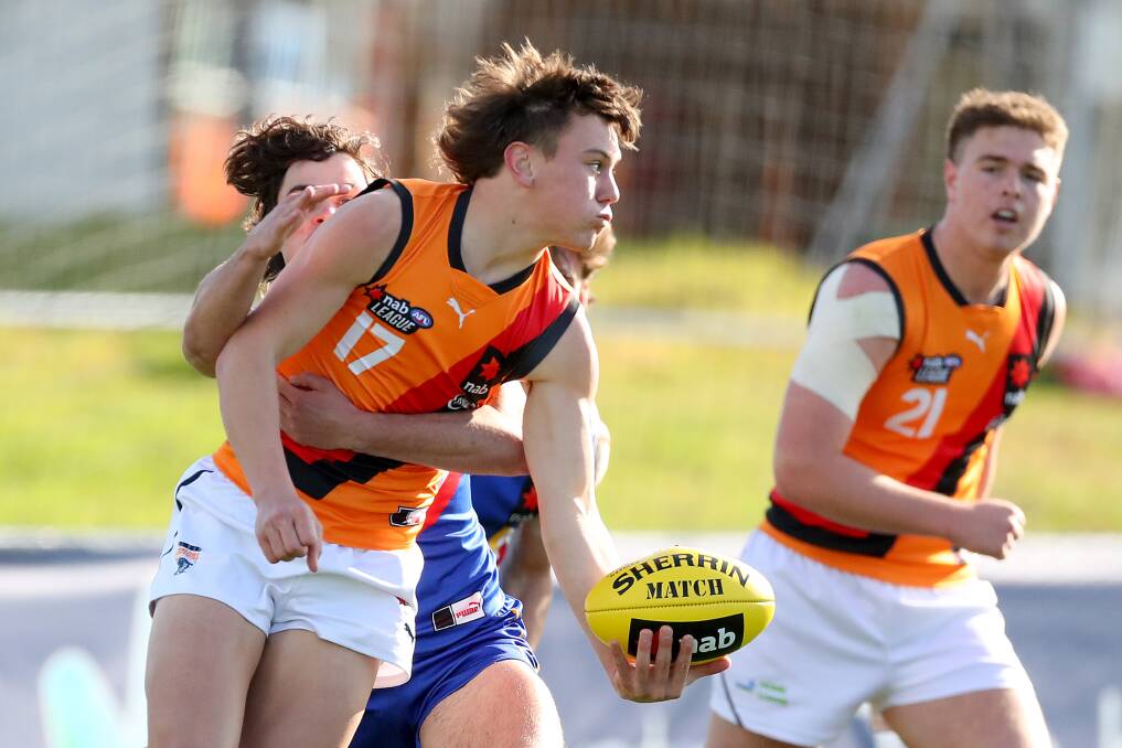 Harry Rowston handballs during the NAB League Boys match between Eastern Ranges and Calder Cannons. Picture by Getty Images
