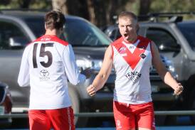 Griffith key forward Henry Delves (15) celebrates a goal with Swans ruckman Nathan Richards during their clash against GGGM on Saturday. Picture by Les Smith