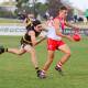 Griffith defender Mason Rosengreen gets a kick away as he's tackled by Wagga Tigers' Will Kirkup. Picture by Les Smith