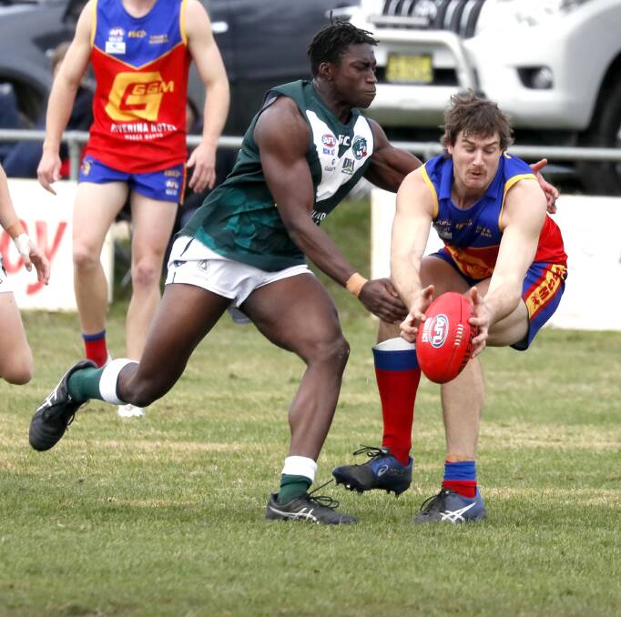 PRESSURE: Coolamon's Gerard Okerenyang tackles GGGM's Jacob Olsson during the Lions 27 point win on Sunday. Picture: Les Smith.