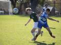 NARROW LOSS: Randwick High's Jack Gibbens battles with Wagga High's Anwar Kambar during their school's clash on Monday. Picture: Madeline Begley.