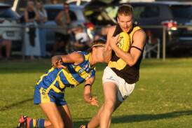 Wagga Tigers forward Cooper Pavitt marks in front of MCUE defender Lewis Pulver during the Good Friday season-opener at Mangoplah Sportsground. Picture by Bernard Humphreys