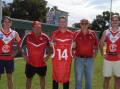 Collingullie-Wagga co-captain Ed Perryman, president Noel Penfold, 2014 premiership co-captain Kal Sykes, 1964 and 1974 premiership player Ken Morrow and vice-captain James Pope show off the one-off guernseys the Demons will wear this weekend against MCUE. Picture by Tom Dennis