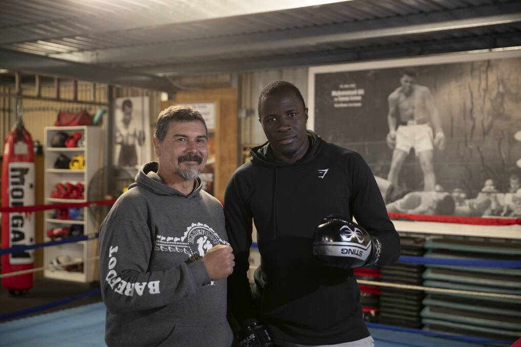 Coach Tony Abbott has been training Simbwa since 2019 and believes the boxer could be representing Australia. Picture: Madeline Begley.