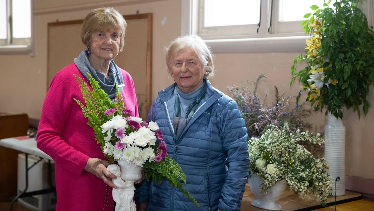 Doris Thomson (left) won first prize in one of the CWA's floral arrangements categories. Pictured with judge Helen Chamberlain. Picture by Madelaine Begley