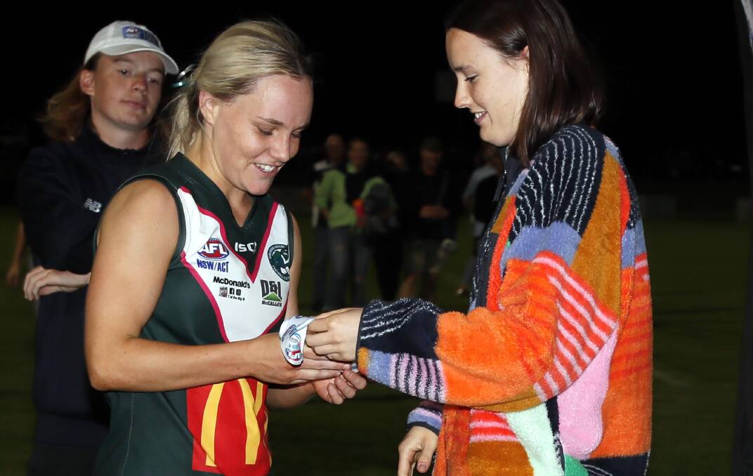 GWS's Zara Hamilton presents Sophie Gaynor with her best on ground medal following the Southern NSW Women's League grand final. Picture by Les Smith