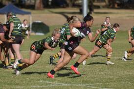 Lele Katoa races out from a scrum, while Ellie Burnett pursues. Picture by Tom Dennis