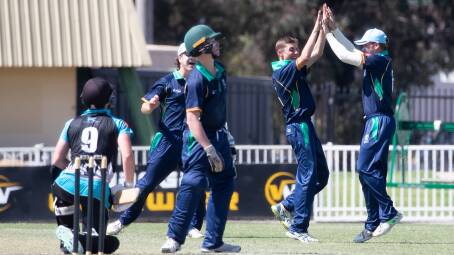 Wagga's Braith Gain (second from right) bowls and catches a ball off the bat of Issac Roxburgh, celebrated by Albury's Jonathan Whiting. Bradman Cup cricket: Riverina v Southern Districts at Robertson Oval. Picture by Madeline Begley